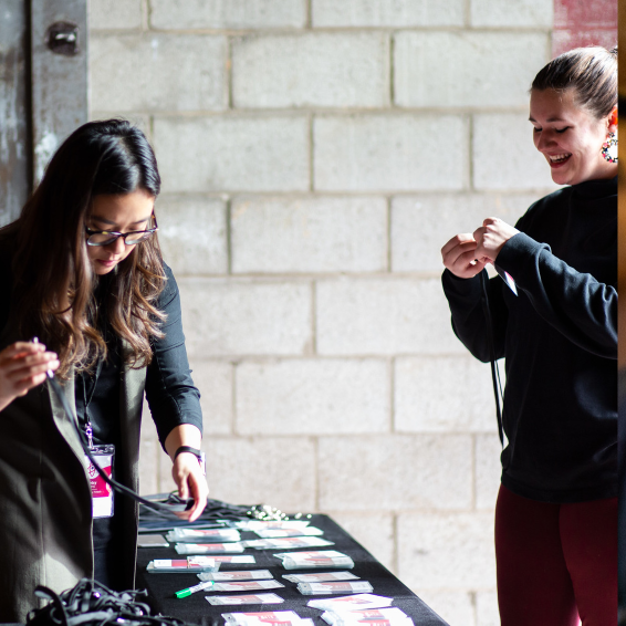 Two attendees at registration table